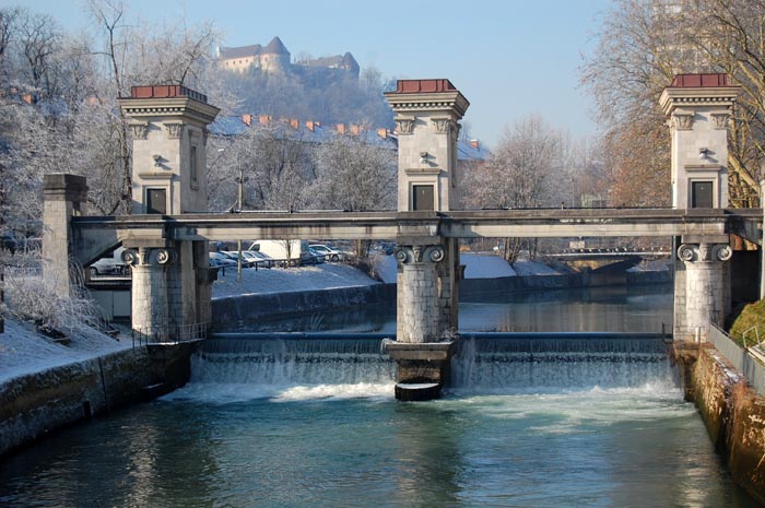 Winter wonderland: Jože Plečnik’s river barrier and a view of the Ljubljana Castle