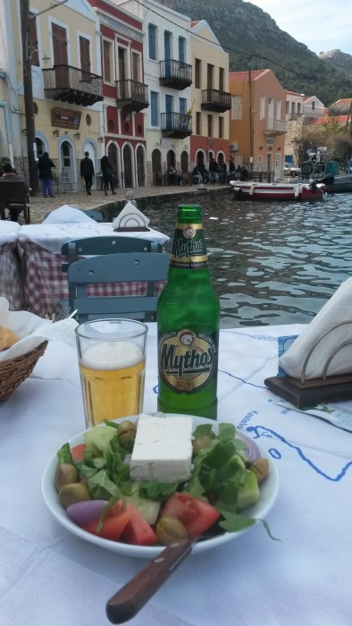 delicious Greek beer and Greek salad. Saganaki just arrived after I took the photo