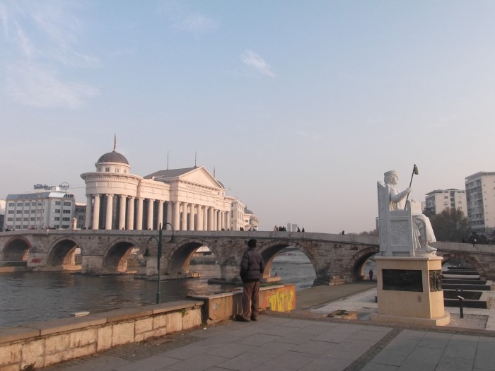 Stone Bridge on Vardar River with the latest built statues and Government buildings by the river.