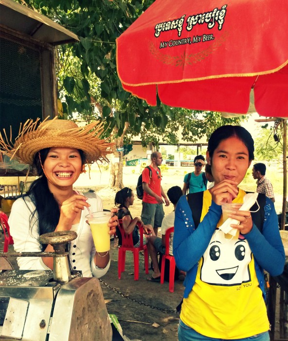 My sisters in Battambang, Chhorvy & Seav Young, drinking sugar cane juice :)